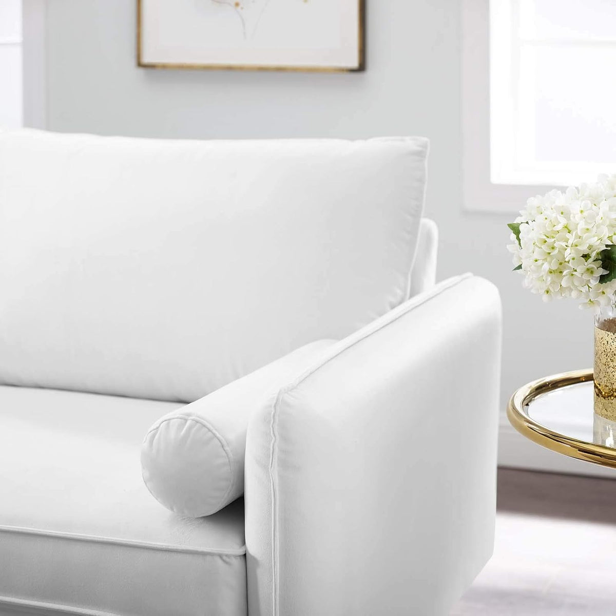 White performance velvet loveseat in a bedroom setting