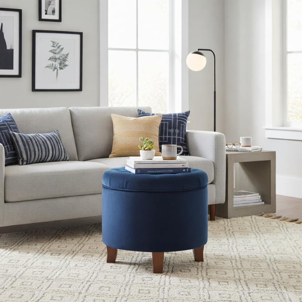 Navy velvet storage ottoman, top view showing button tufting