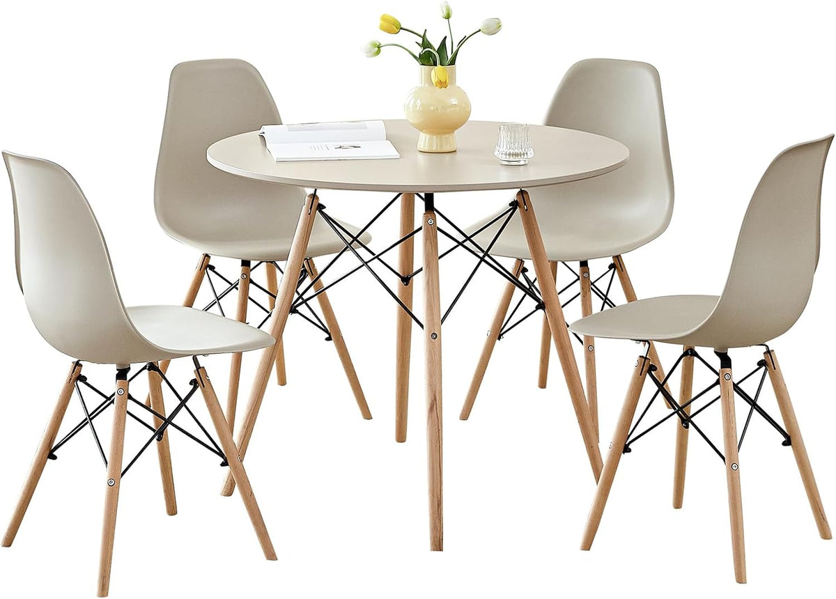 Scandinavian round dining set with sand tabletop and four molded plastic chairs on beech wood legs
