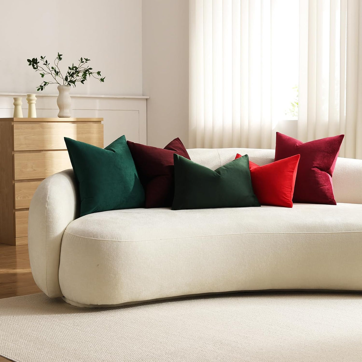 DEZENE wine red velvet pillow covers styled in a living room setting