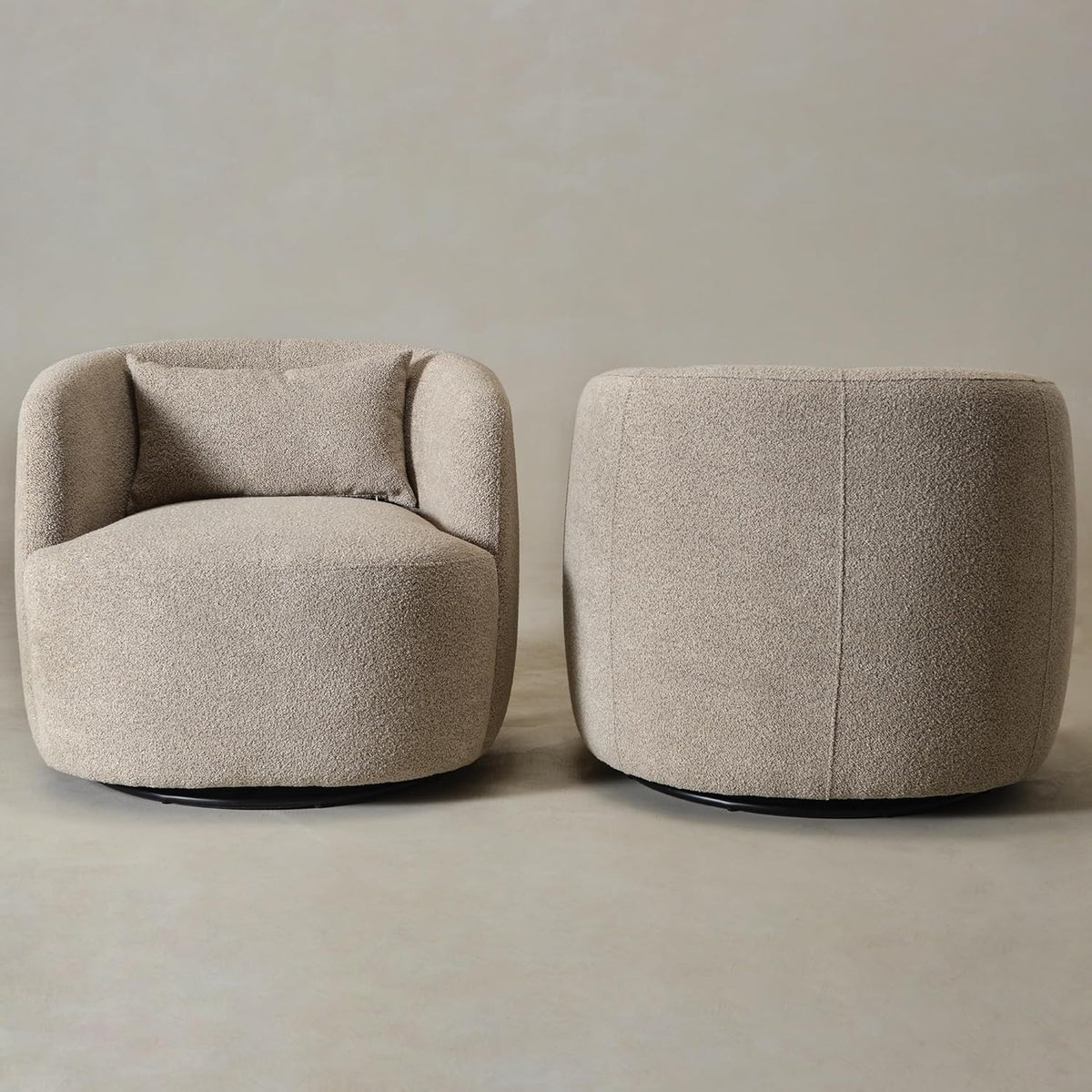 Boucle swivel barrel chair detail of black metal base