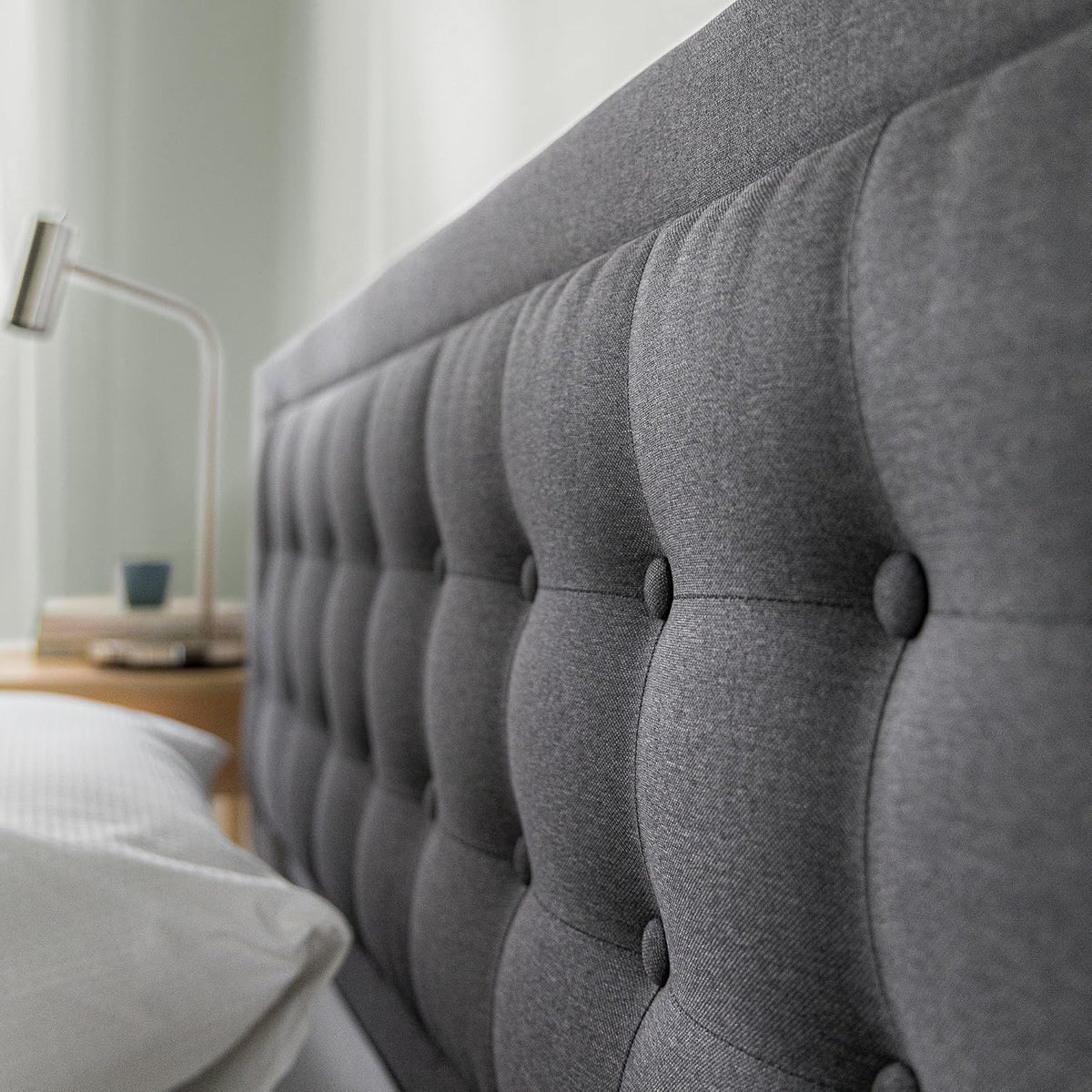 Upholstered platform bed frame side profile view