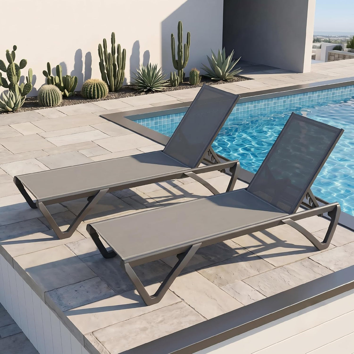Grey aluminum sling chaise lounge, side view showing recline positions