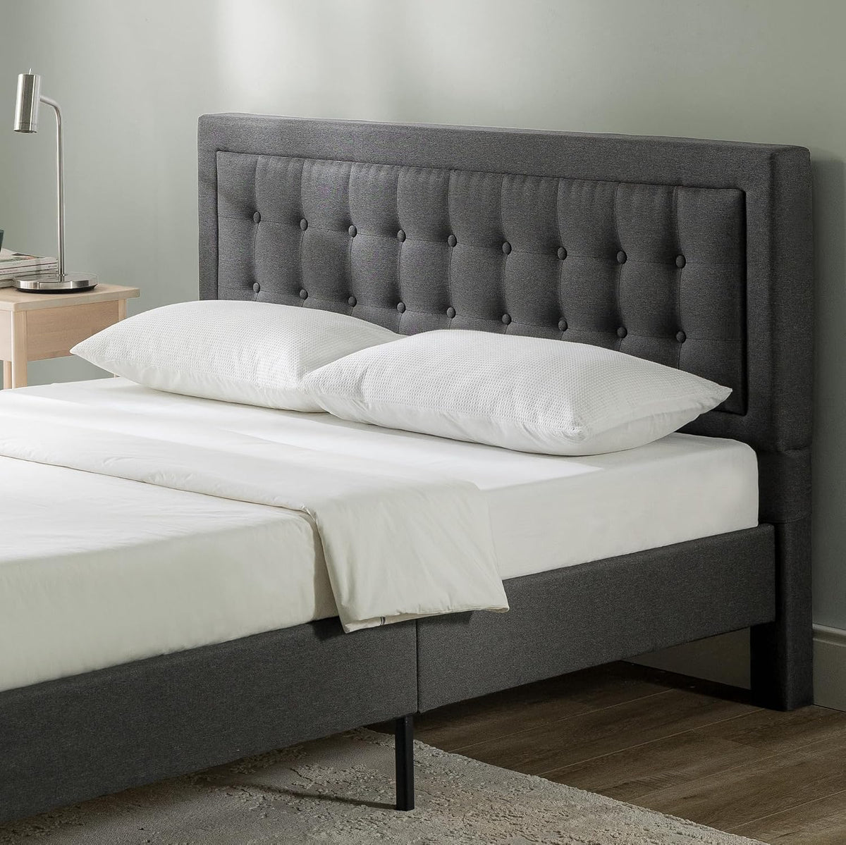 Upholstered platform bed frame styled in a bedroom