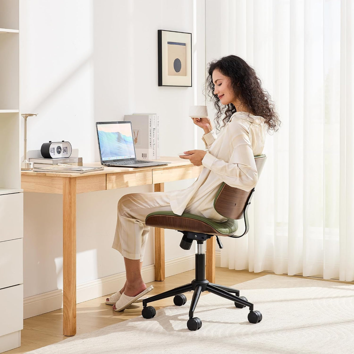 Sage green armless desk chair, rear view showing curved walnut wood backboard