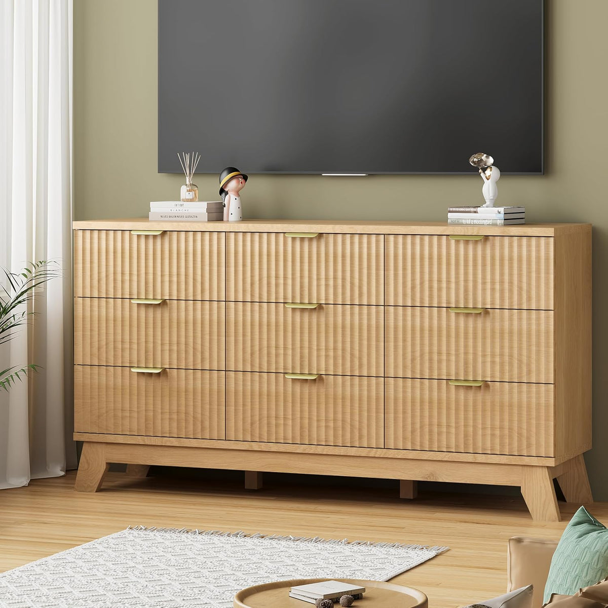 Fluted natural oak 9-drawer dresser styled in a bedroom setting with decor on top