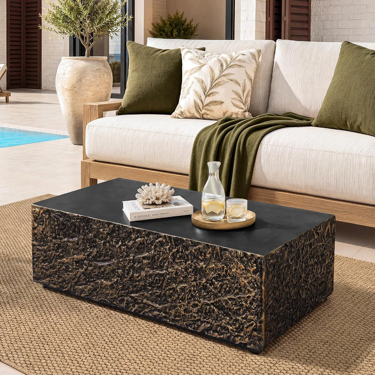 Round travertine-look outdoor coffee table, off-white, close-up of concrete-inspired surface