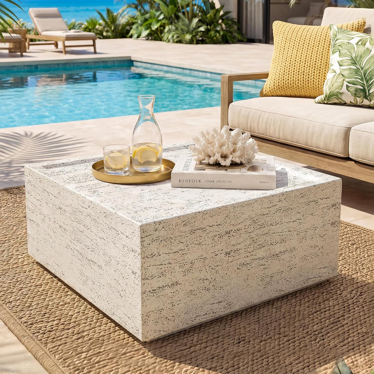Round travertine-look outdoor coffee table, off-white, front view