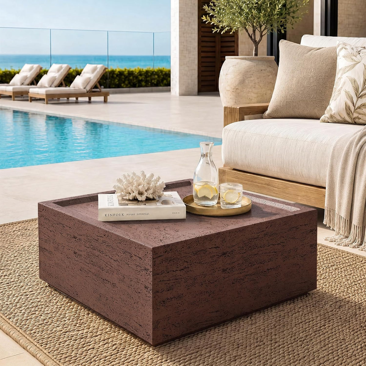 Round travertine-look outdoor coffee table, off-white, low profile side view