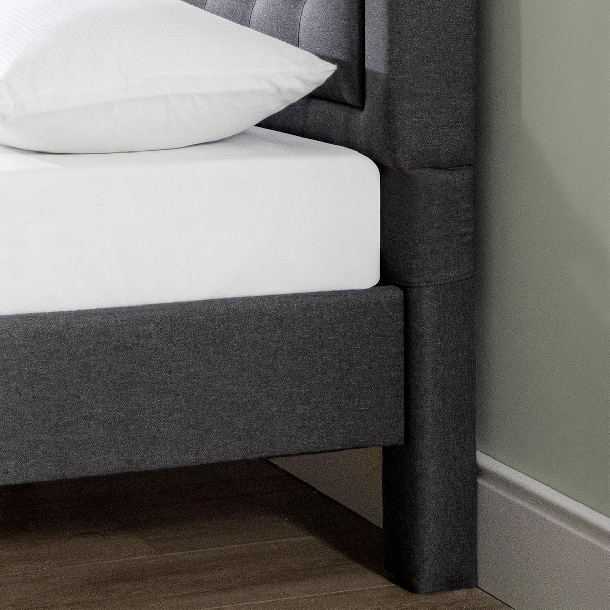 Upholstered platform bed frame detail of fabric texture