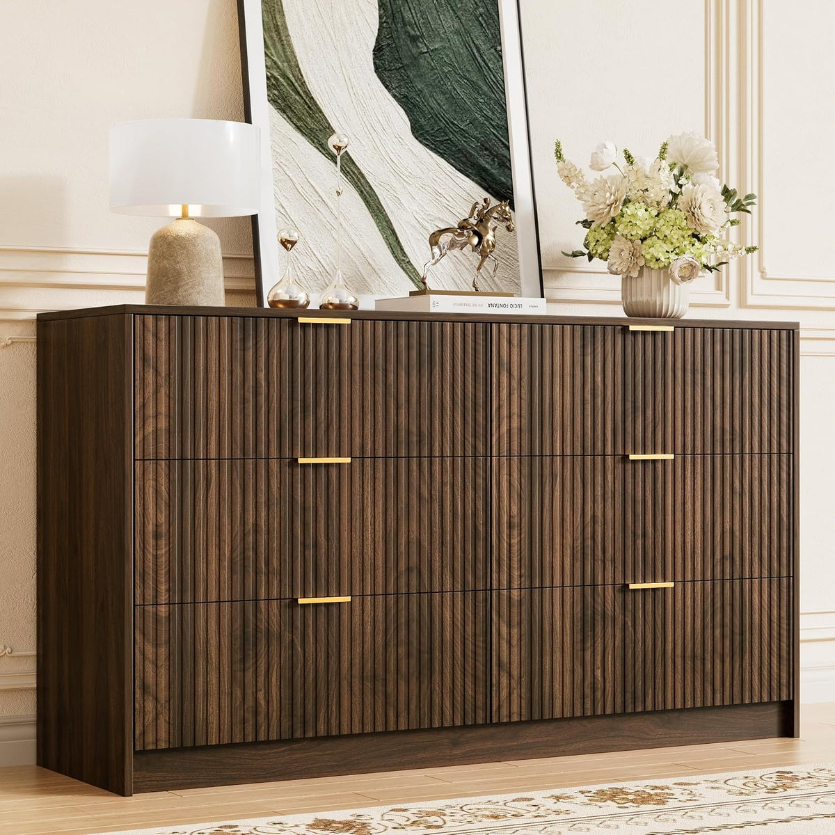 Fluted walnut 6-drawer dresser with gold handles, front view in a bedroom setting